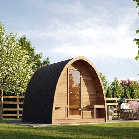 SaunaLife Model G3 - a wooden sauna with a fence and trees