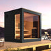 SaunaLife Model G6 Pre-Assembled Outdoor Home Sauna - a small black sauna on a dock