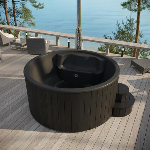 SaunaLife Model S4B Wood-Fired Hot Tub - a hot tub on a deck overlooking a body of water