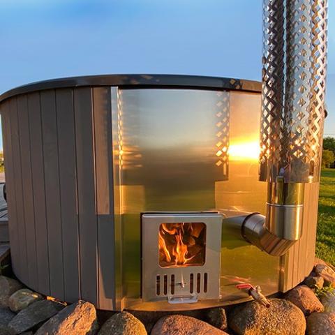 SaunaLife Model S4N Wood-Fired Hot Tub - a hot tub with a fire in it