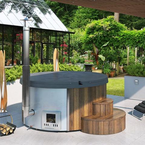 SaunaLife Model S4N Wood-Fired Hot Tub - a hot tub with a wood stove assembled outdoor with trees in the background