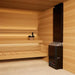 Saunum AIR 10 WiFi Sauna Heater Package - on the floor next to a bench 