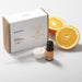 Saunum Sweet-Orange Aroma Oil with Reservoir, 10ml - with oranges and dropper next to a box