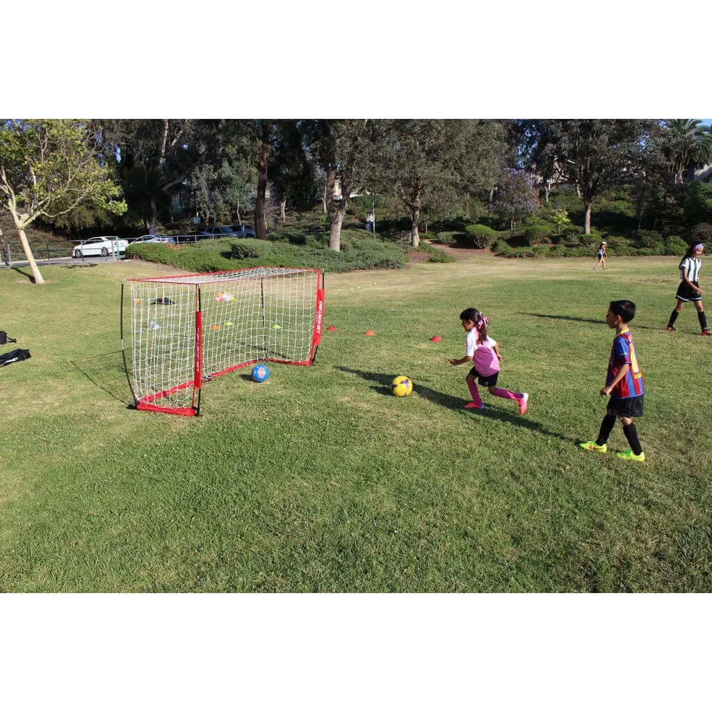 Children in a field playing soccer using Powernet Soccer Goal 8x4 Portable Bow Style Net S002