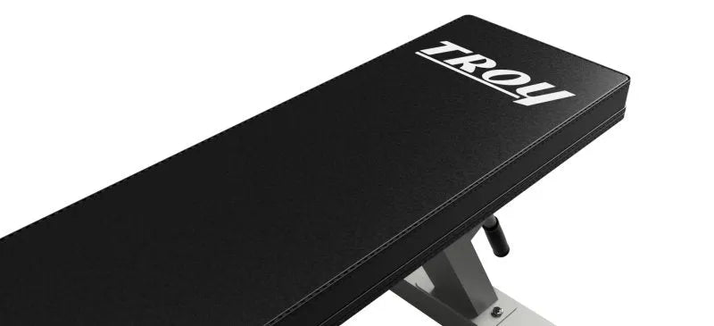 Troy Flat Bench - aerial view of bench with Troy logo