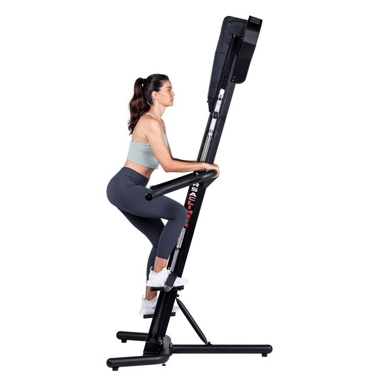 VersaClimber SM-Magnetic Sport Model - Side view of a woman climbing on machine