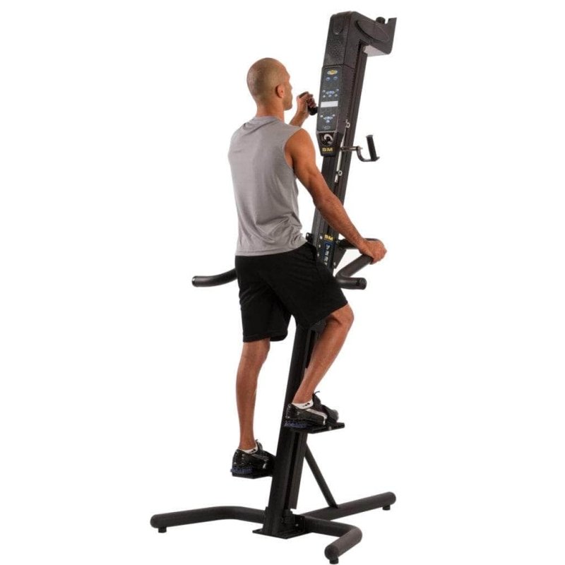 VersaClimber SMA Sport Model Vertical Climber - a man in gray top climbing on VersaClimber