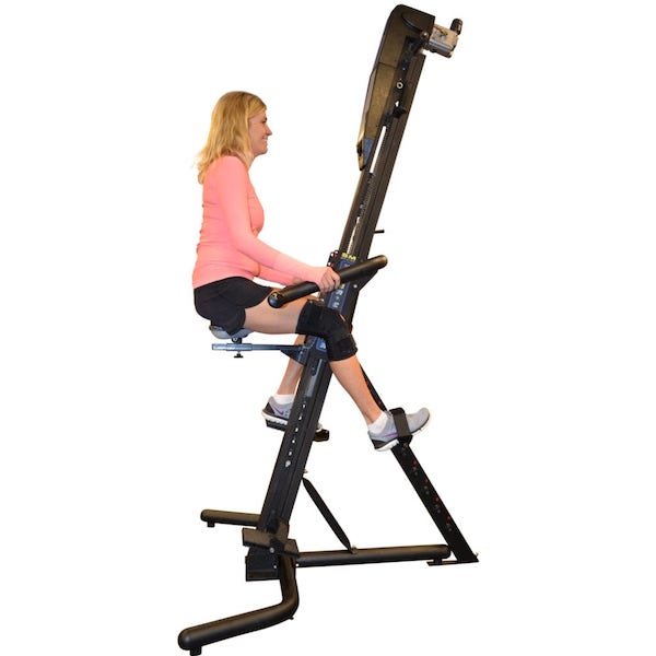 VersaClimber SRM Sport Rehab Model - Woman in peach top sitting on an exercise machine