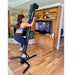 VersaClimber TSA Commercial Vertical Climber - back view of a woman exercising while watching TV