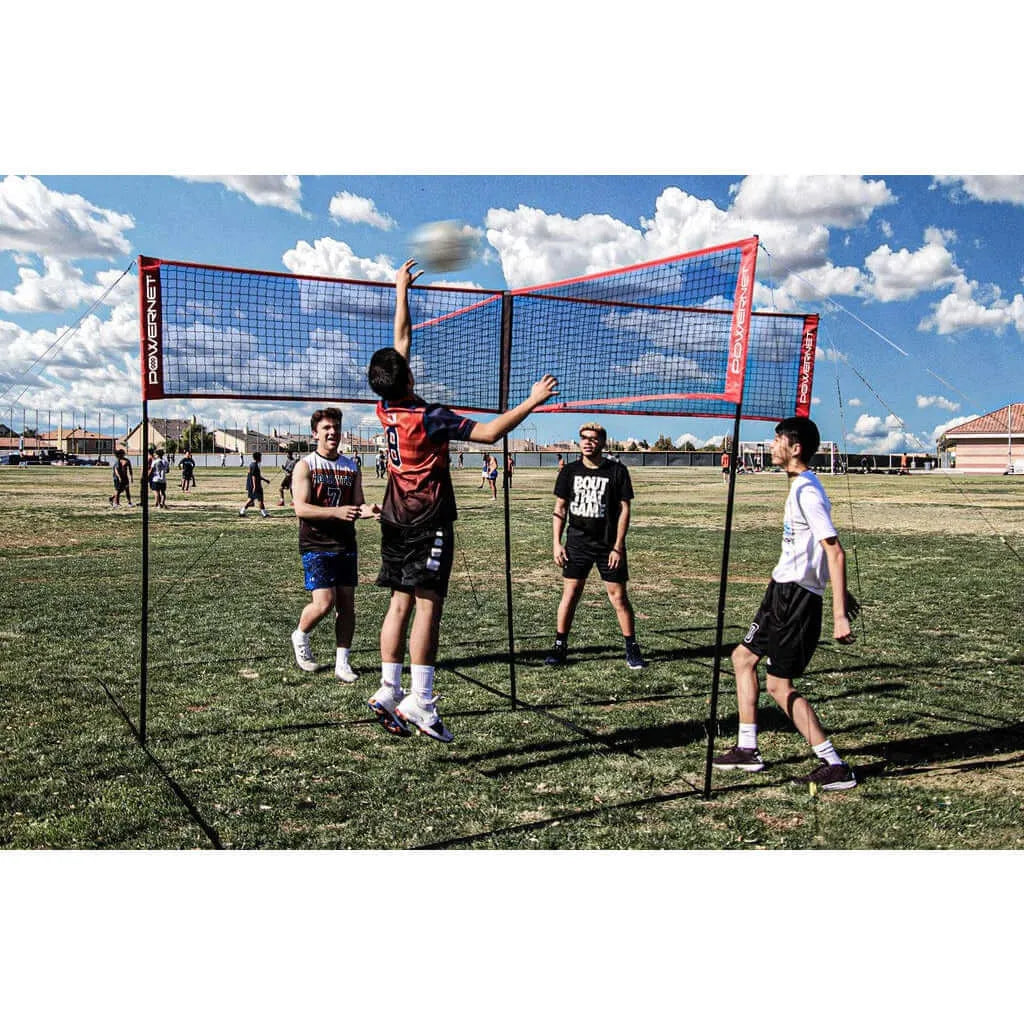 Powernet Volleyball Four Square Net in a field used by four people playing volleyball