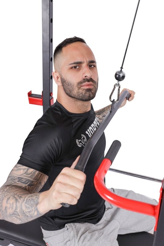 Vortex Strength Power Rack Full Set (Cage + Barbell + Plate Set + Adjustable Bench)  - close up photo of the man holding the lat attachment