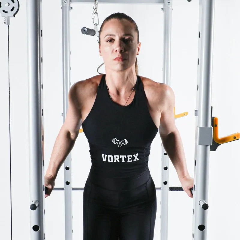 Vortex Strength SRVXG350 Power Cage / Lat Pulldown with Dip Attachments + Landmine - Close up photo of woman holding dips