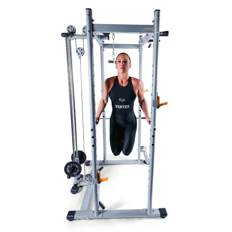 Vortex Strength SRVXG350 Power Cage / Lat Pulldown with Dip Attachments + Landmine - Woman working out using the equipment in dips exercise