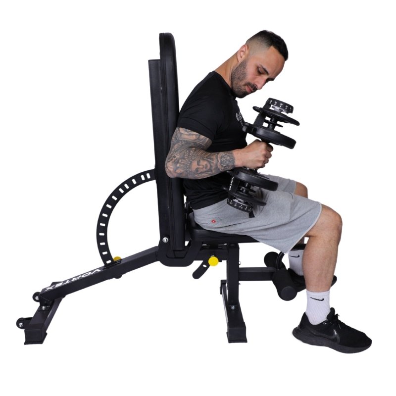 Vortex Strength VFID50 Adjustable Bench - Man on bench while holding dumbbells