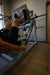 Vortex Strength VLP1000 Leg Press / Hack Squat Combo - actual product photo of man working out with focused photo of the diamond  foot plate