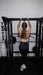 Vortex Strength VX1000 Smith Machine and Functional Trainer - woman holding the pull up bar  