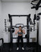 Vortex Strength VX1000 Smith Machine and Functional Trainer - Front view of the actual equipment photo with woman working out holding  a barbell