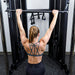 Vortex Strength VX500 Functional Trainer (2 x 160lb Weight Stacks) - Back photo of the woman holding the lat pull down