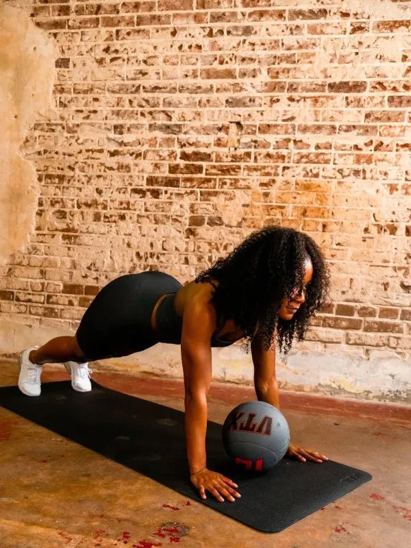 VTX Yoga Mat - woman using a yoga mat