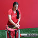 Pro softball player Mo Mercado behind Powernet Wheeled Ball Caddy Cart for Baseball Softball and Tennis 1091