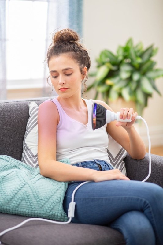 Yellow LED Light Therapy - woman sitting on couch