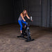 Body-Solid Endurance Spin Bike ESB250 - woman on bike looking in the monitor