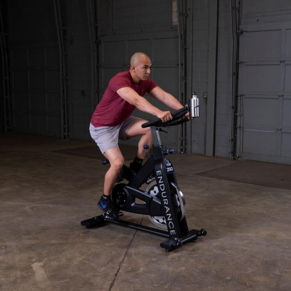 Body-Solid Endurance Spin Bike ESB250 - man working out using the bike