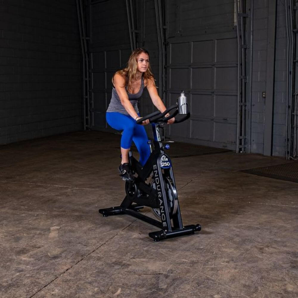 Body-Solid Endurance Spin Bike ESB250 - a different woman is on the bike on training