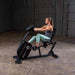 Body-Solid Endurance Recumbent Bike B4RB - woman using the machine and hands on the  handle