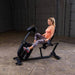 Body-Solid Endurance Recumbent Bike B4RB - woman on side view using the bike 
