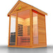 Medical Nature 7 Outdoor Infrared Sauna - Low angle view of wooden sauna with glass door and windows