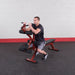 Best Fitness BFPL10 Preacher Leg Attachment For Bench -  man sitting and trying out the product