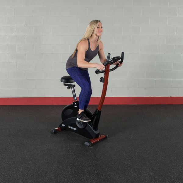 Best Fitness BFUB1 Upright Bike - woman happily doing cardio workout