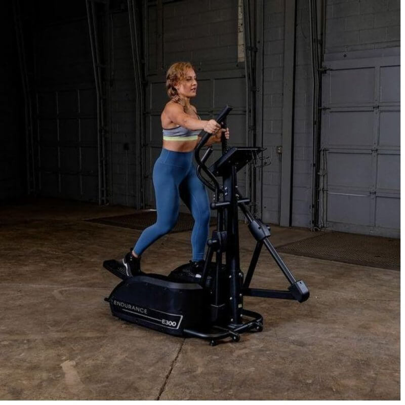 Body-Solid Endurance Center Drive Elliptical E300 - Woman doing cardio exercise