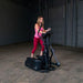 Body-Solid Endurance Center Drive Elliptical E300 - a woman on an exercise machine