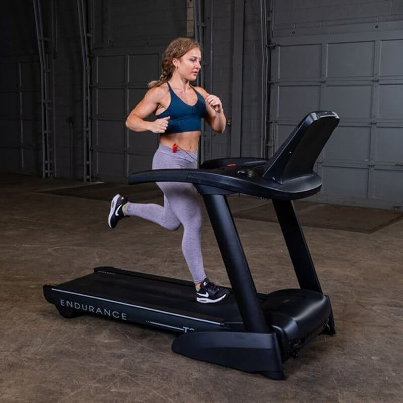 Body-Solid Endurance Folding Treadmill T25 - side view photo of woman working out