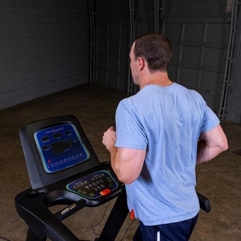 Body-Solid Endurance Folding Treadmill T25 - Back photo of the man using treadmill