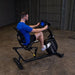 Body-Solid Endurance Recumbent Bike B4RB -  side view photo of a man using the product