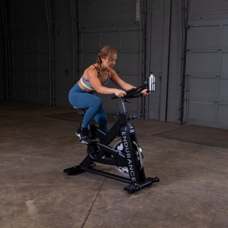 Body-Solid Endurance Spin Bike ESB250 - woman on training 