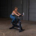 Body-Solid Endurance Spin Bike ESB250 - woman on training using bike in black color