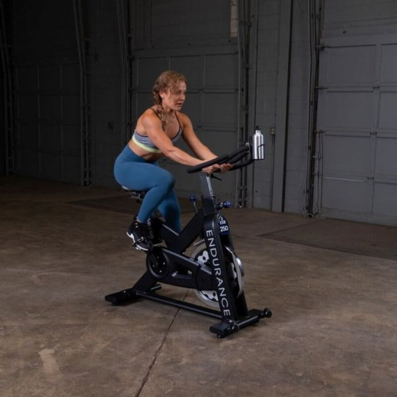 Body-Solid Endurance Spin Bike ESB250 - woman on the bike