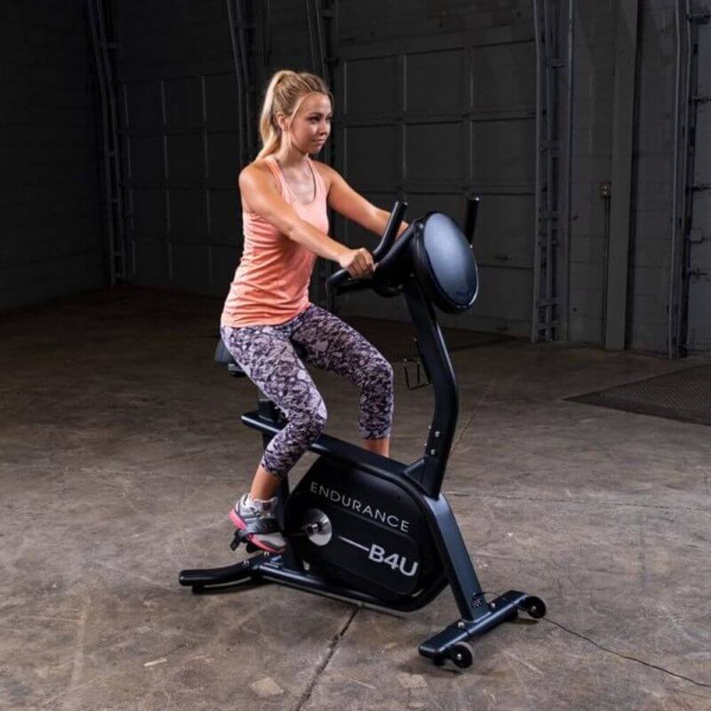 Body-Solid Endurance Upright Bike B4UB - Woman exercise on bike