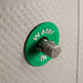 Cryospring Portable Ice Bath - a green and white button with a round metal knob