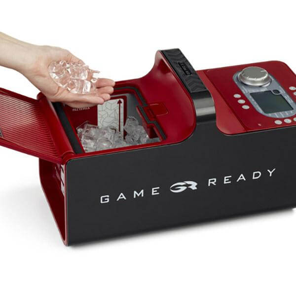 Game Ready Ice Machine GRPro 2.1 Compression Unit - a hand holding a piece of ice in a machine