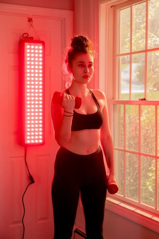 Hooga HG1000 Red Light Therapy Device - woman wearing exercise outfit