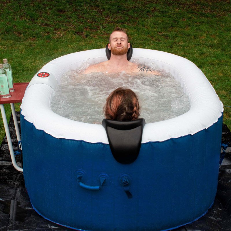 Oval Inflatable Jetted Hot Tub with Drink Tray and Cover - 2 Person inside the hot tub