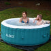 Round Inflatable Jetted Hot Tub with Cover - man and woman inside the hot tub