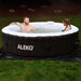 Round Inflatable Jetted Hot Tub with Cover - man and woman having fun inside the hot tub