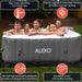 Square Inflatable Jetted Hot Tub with Cover - photo of family inside the tub 