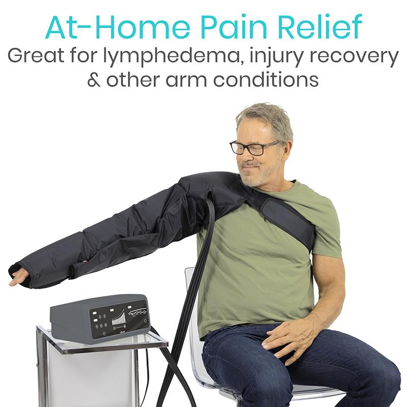 Vive Arm Compression Pump - Swelling & Pain Relief - a man sitting in a chair with a black arm band